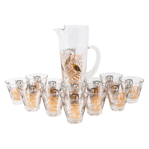 http://thehourshop.com/cdn/shop/products/11799-Vintage-Gold-Peacock-Pitcher-And-12-Glasses-pitcher_grande.jpg?v=1616511645
